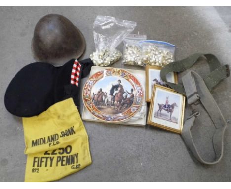Militaria including a WWII helmet, Navy cap, belts, prints, uniform buttons and military themed Wedgwood plates 