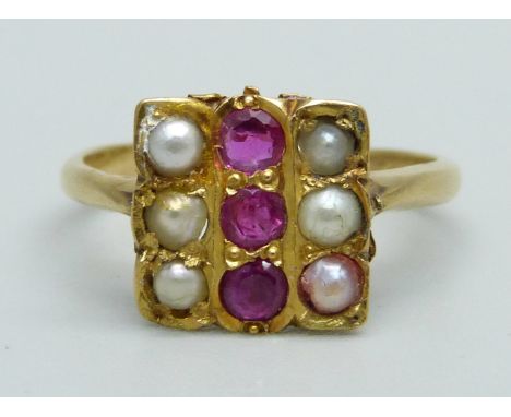 A ruby and half pearl ring, marked 21K, 3.2g, L 