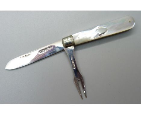A silver and mother of pearl fruit knife and olive fork combination, Sheffield 1910 