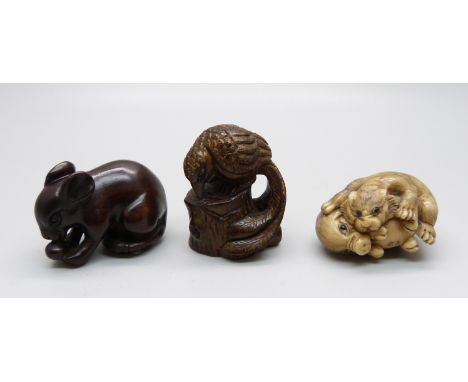 Three carved netsuke, mouse, bird, and pig and tiger 