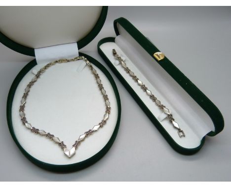 A silver, mother of pearl and marcasite necklace and matching bracelet 