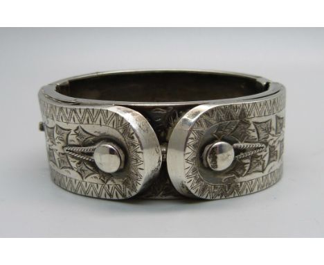 A Victorian silver bangle, Birmingham 1883, (opening 46mm x 60mm) 