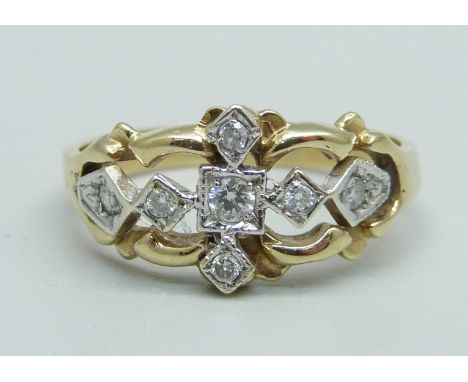 A 9ct gold and seven stone diamond cluster ring, 3.1g, R 