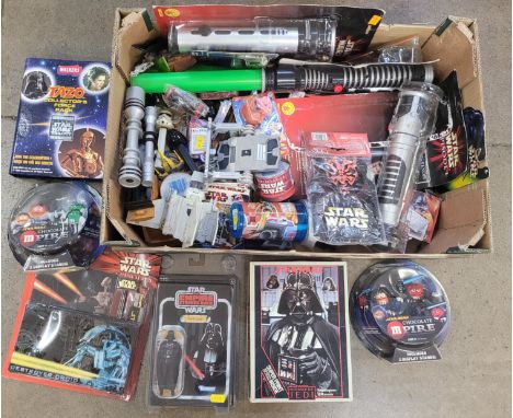 A collection of Star Wars items, toys, figures, etc. 