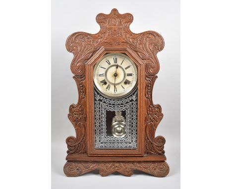 An Early 20th Century American Gingerbread Mantle Clock with Ansonia Movement, Working Order, 56cm high 