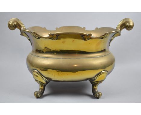 A Mid 20th Century Brass Two Handled Oval Planter on Scrolled Feet, 42cm wide 