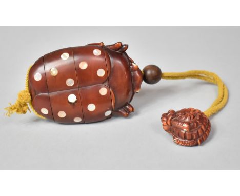 A Japanese Novelty Wooden Inro in the Form of a Bug with Inset Mother of Pearl Disk Decoration, Glass Eyes, Mother of Pearl S
