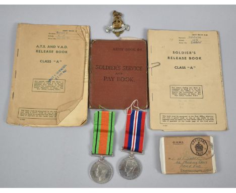 A Vintage Royal Windsor Tin Containing WWII Medals, Soldiers Service and Pay Book, Soldiers Relief Book and Military Cap Badg