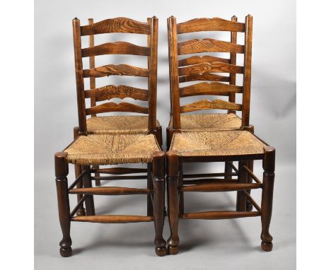A Set of Four Ladder back Dining Chairs with Rush Seats and Upholstered Pad Cushions 