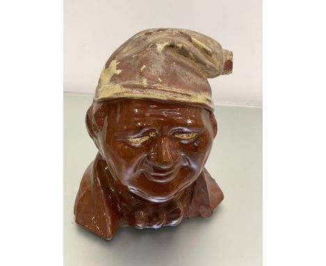 A Scottish pottery model of Souter Johnny flagon, missing stopper, with partial decoration (29cm x 24cm x 20cm) (losses)