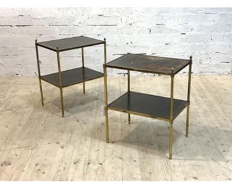 A pair of mid century lamp tables, each with two tiers having inset tooled leather surface, on a brass frame with cast acorn 