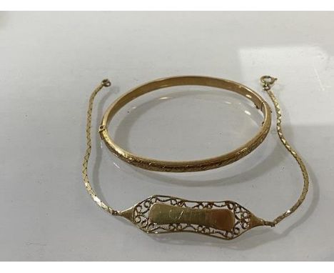 A 1922 hallmarked Birmingham 9ct hinged bangle with foliate engraving to one half (5cm x 4.5cm) and bracelet with panel inscr