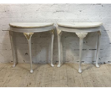 A pair of white painted hardwood demi lune console tables, H75cm, W75cm, D39cm