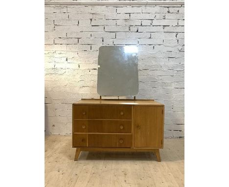 Meredew, A mid century light oak veneered dresseing chest with swing mirror, three drawers and a cupboard, H159cm, W115cm, D5