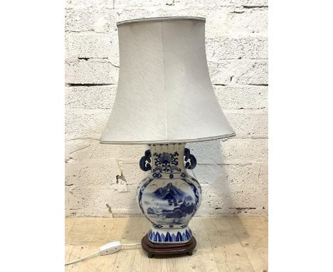 A blue and white ceramic table light in the form of a vase, with shade, H78cm