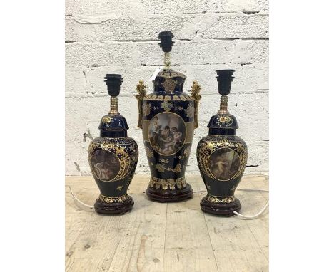 A large Vienna style blue and gilt ceramic twin handled urn shaped table light, (H58m) together with a pair of similar, of ba
