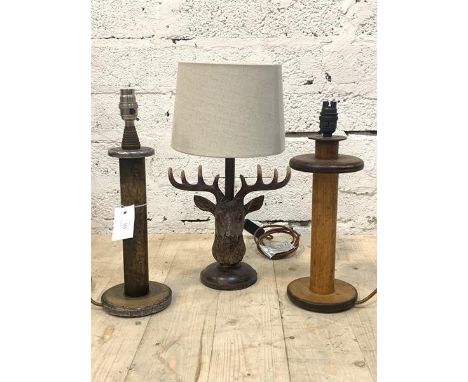 Two similar table lights, constructed from textile bobbins, (H39cm) together with a table light in the form of a roebuck head
