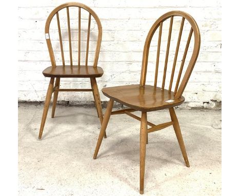 Ercol, a pair of hoop and spindle back chairs, with saddle seats, raised on turned tapered supports with stretchers, H86cm, W