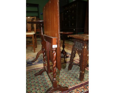 A metamorphic Mahogany Firescreen table having twist supports, the top, 23 1/2" x 17 3/4".