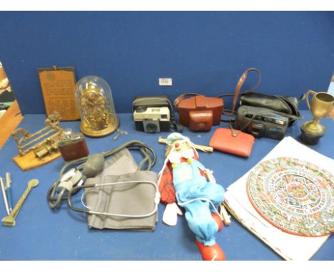 A quantity of miscellaneous including a puppet, Anniversary clock, Coronet camera, cased Kodak camera, glass hip flask, cased