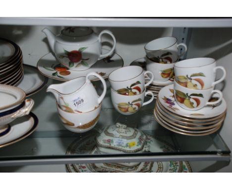 A Royal Worcester ''Evesham'' Teaset comprising six cups, saucers and tea plates and milk jug, sugar bowl, teapot and footed 