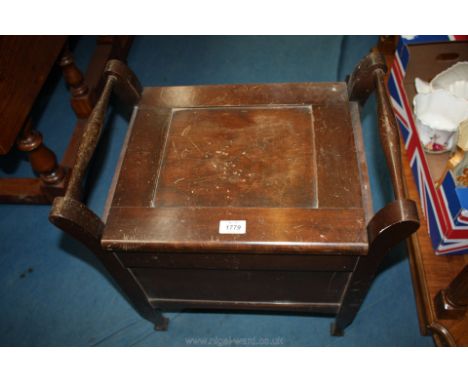 An unusual Mahogany commode Stool in the style of a piano stool