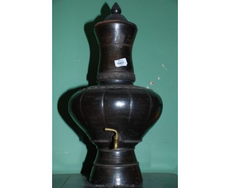 A large vintage ceramic water dispenser, possibly Thai.