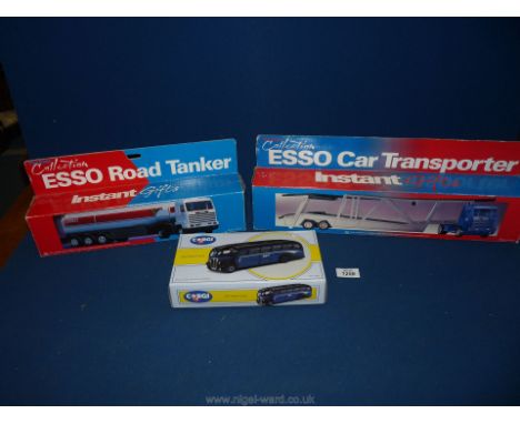 A blue Corgi Arc regal coach, a ESSO car transporter and an ESSO road tanker.