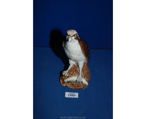A Royal Doulton figure of an Osprey for Whyte and Mackay Scotch Whiskey by D. Lyttleton.