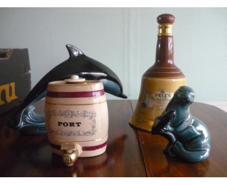 Various Poole pottery figures including dolphins and a seal, Carlton ware, Motto ware, Beswick, Doulton Gloria D4937 serving 