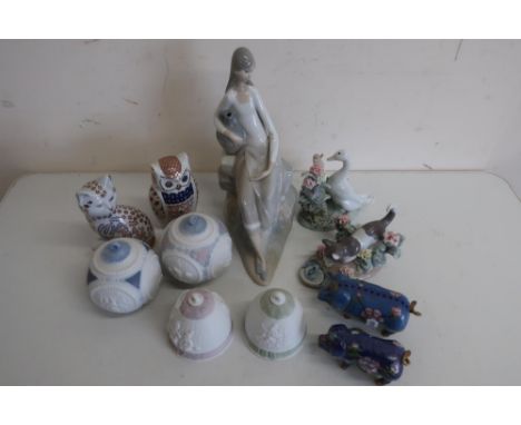 Nao figure of a young woman holding a vase, Lladro figure of a cat, Lladro figure of a duck, Royal Crown Derby style cat and 