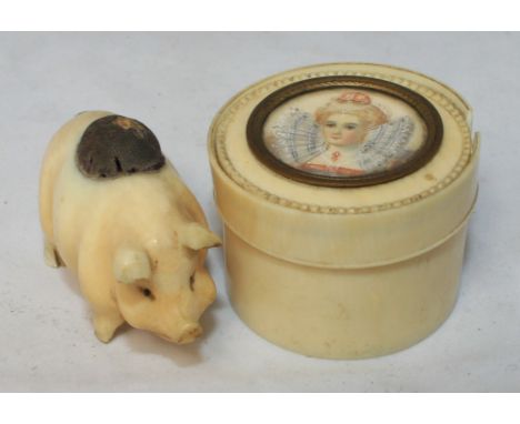 		An ivory pig pin cushion and an ivory trinket box. The cover with inset miniature of a 16th Century lady. C.R. Losses to th