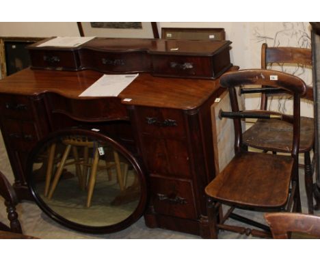 		A Victorian mahogany dressing table lacking superstructure, two Victorian kitchen chairs, a tile top low table and a 1950's