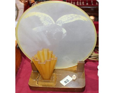 		An Art Deco lamp with round shade painted with an eagle. C.R. Losses to the painted eagle on shade