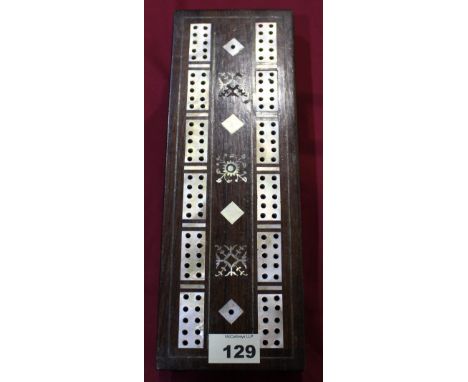 		A rosewood and mother of pearl inlaid cribbage board. C.R. Minor losses to the foliate inlay