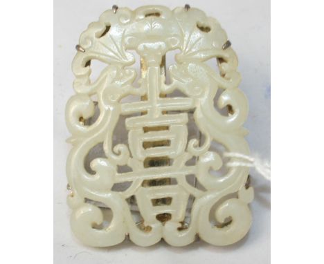 		A Chinese white jade pierced pendant now set as a clip in white metal. 2' high. C.R. All good