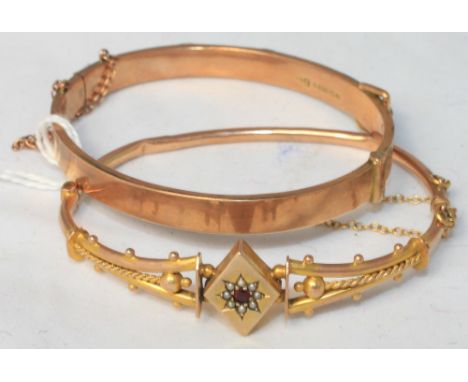 		Two hinged bangles. In gold marked '375'. C.R. The gem set bangle with crease to the hoop