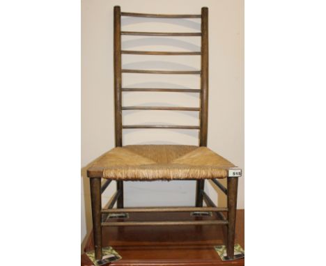 		A shaker style chair with ladder back and rush seat