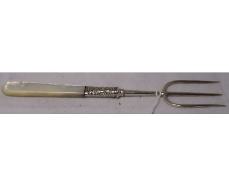 		A silver pickle fork with mother of pearl handle and repousse embossed collar. Sheffield 1904. 7 1/4' long. C.R. All good