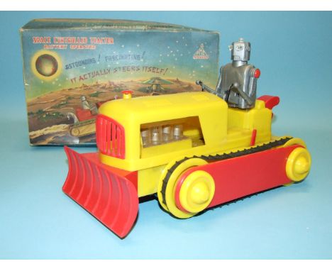 A PMC Product (Hong Kong) Space Controlled Tractor, battery-operated, boxed with packing.