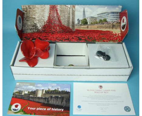 A Paul Cummins ceramic poppy from "The Blood Swept Lands and Seas of Red" installation at the Tower of London 2014, boxed wit