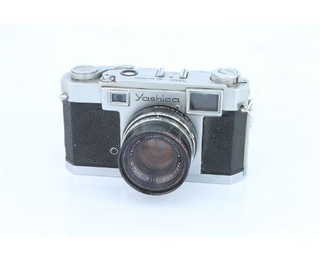 A Yashica 35 Rangefinder Camera, chrome, with fixed Yashinon f/1.9 45mm lens, body, F-G, slight peeling of leatherette, lens,