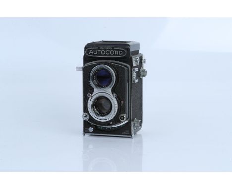 A Minolta Autocord, TLR Camera, with Minolta Rokkor f/3.5 75mm lens, body, G, shutter working, lenses, F, some internal haze 