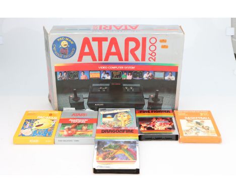 An Atari 2600 Video Computer System, complete with six games including Dragonfire, Fire Fighter, Pac-Man, Real Sports Tennis,