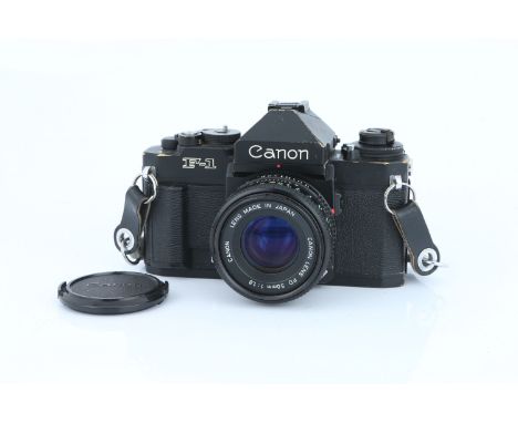 A Canon F-1 New SLR Camera, black, with FD f/1.8 50mm lens, body, F-G, shutter working, lens, G-VG, some light internal haze