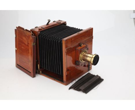 An Unmarked Stereo Mahogany &amp; Brass Field Camera, with unmarked f/8 brass lens, body, G, roller-shutter working, lens, F,