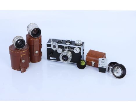 An Argus C3 Rangefinder Camera, complete with three lenses, Cintar f/3.5 50mm, Sandmar Wide f/4.5 35mm and Tele-Sandmar f/4.5