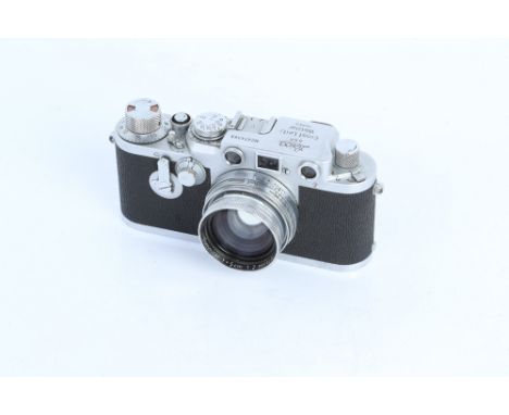 A Leica IIIc Rangefinder Camera, chrome, with Leitz Summitar f/2 50mm lens, body, F, shutter working, lens, VG, some light in