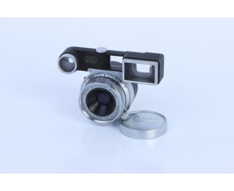 A Leitz Summaron f/3.5 35mm Lens, with ocular attachment, chrome, serial no. 1520326, body, F-G, elements, G, some internal h