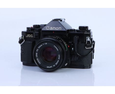 A Canon A-1 SLR Camera, black, with FD f/1.8 50mm lens, body, VG, shutter not tested, lens, VG, some light internal haze, com